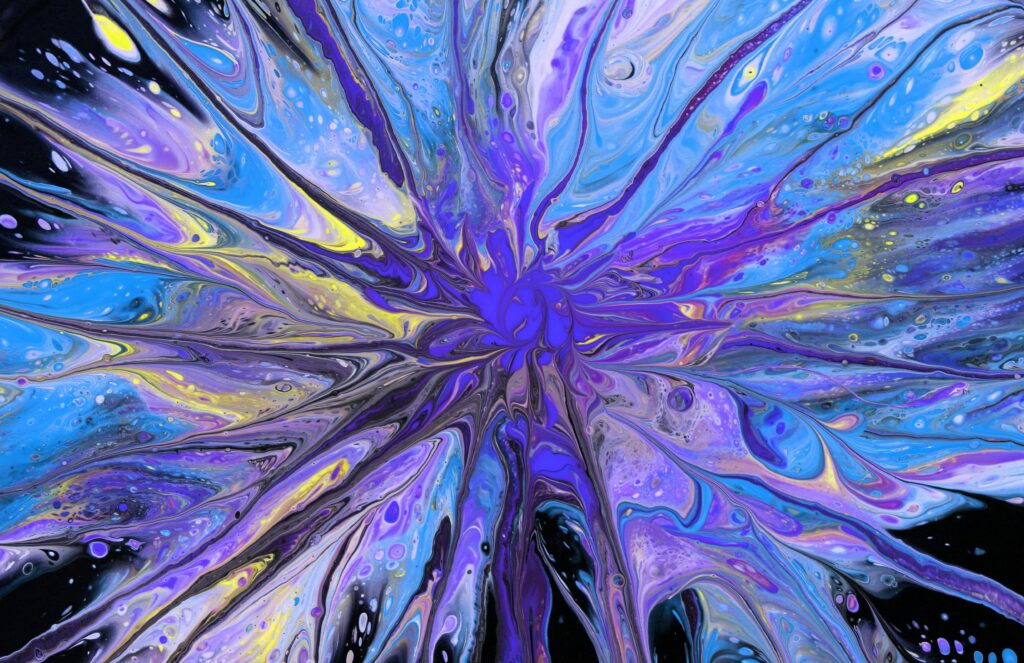A vibrant and dynamic swirl of blues and purples in abstract fluid art.
